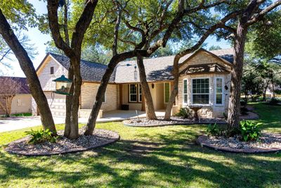 Beautiful Trinity Model, nestled under trees front and back on a large lot. | Image 1