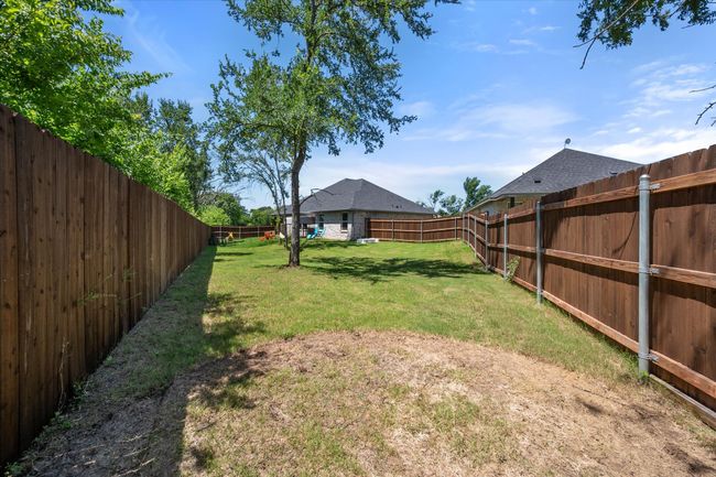View of fenced backyard | Image 24