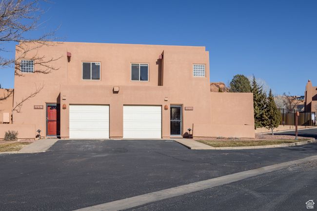 Pueblo-style house with a garage | Image 34