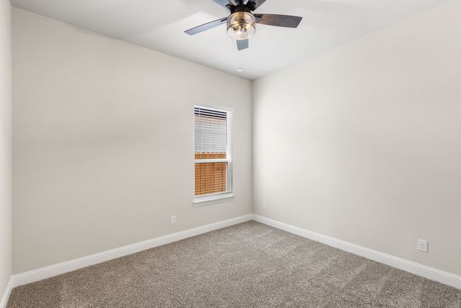 Secondary bedroom with baseboards, carpet floors, and ceiling fan | Image 20
