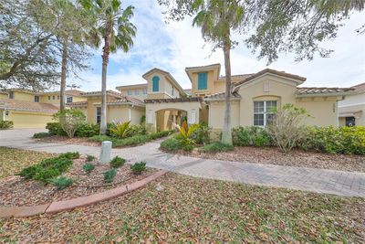 Pride of home ownership is everywhere in this community. With custom pavered sidewalks and driveways, lighted streetlamps, beautiful oaks and tall swaying palm trees, this is considered one of the prettiest streets in all of Sun City Center. | Image 3