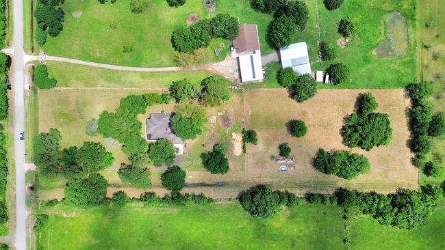 A stunning aerial view of your 5.5-acre haven—nestled among towering oaks with space to dream, grow, and thrive. | Image 41