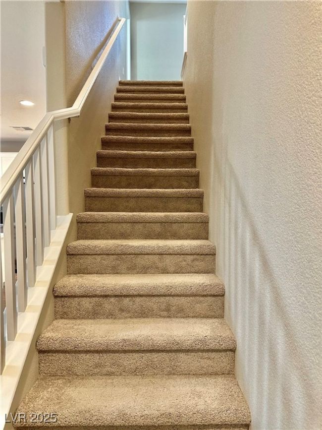 Stairway featuring visible vents and a textured wall | Image 21
