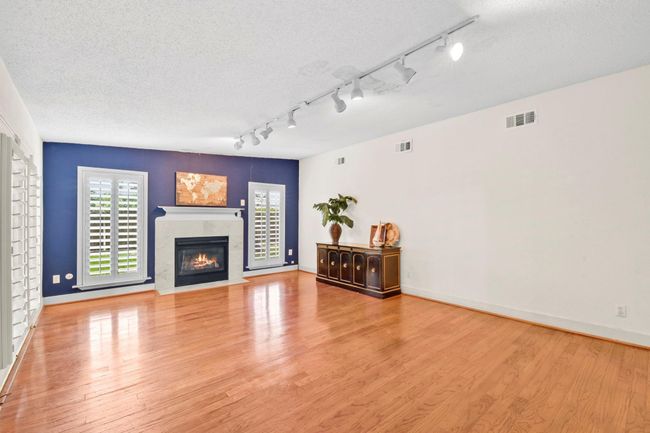 This expansive living room effortlessly accommodates oversized furniture, offering ample space for comfort and style. | Image 7