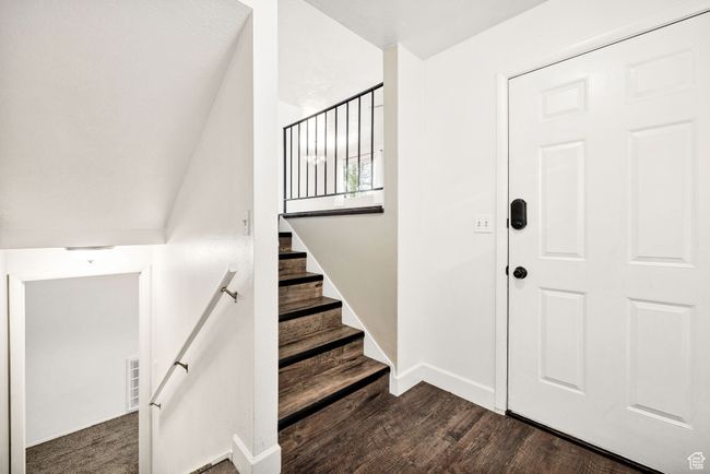 Stairs featuring wood finished floors and baseboards | Image 6