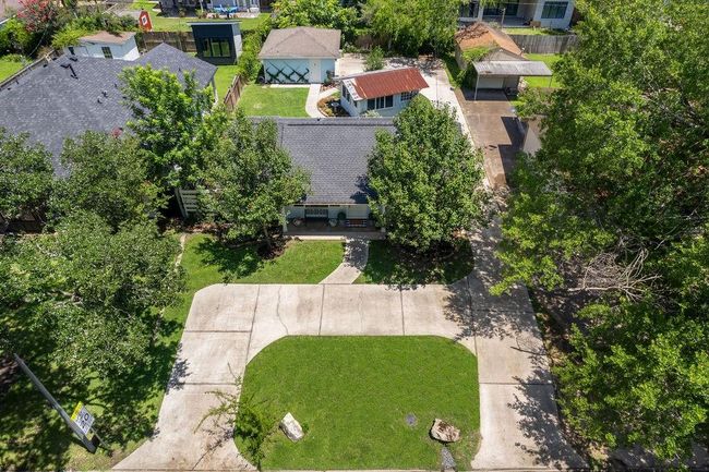 Aerial view of 1726 Saxon Drive. Notice the layout! Circle driveway + long private driveway that wraps around the back, 2-car garage, and charming garden shed. | Image 27