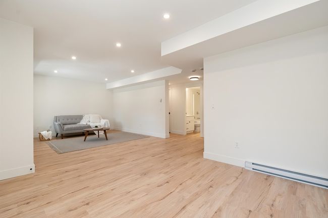 Sitting room with recessed lighting, light wood-style floors, and a baseboard radiator | Image 30