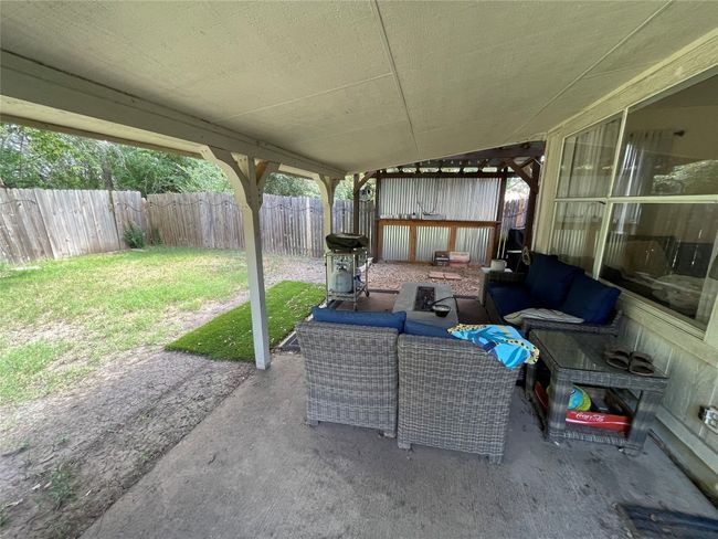 Fenced backyard featuring an outdoor living space, a patio, and area for grilling | Image 8