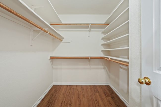 Primary walk-in closet. 9349 Bernoulli Dr., Austin, TX 78748 | Image 21