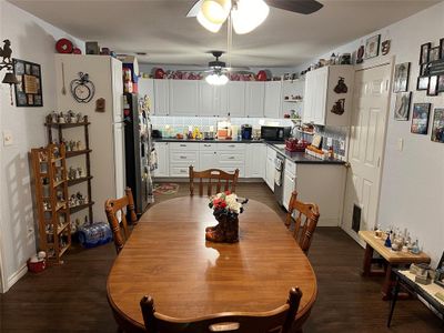 Dining space with ceiling fan and dark hardwood / wood-style floors | Image 3