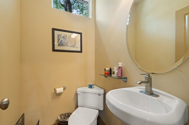 Bathroom with a sink and toilet | Image 31