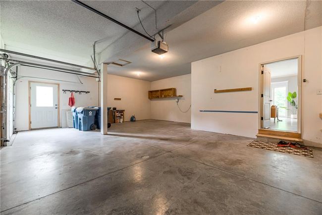Garage with a garage door opener | Image 21