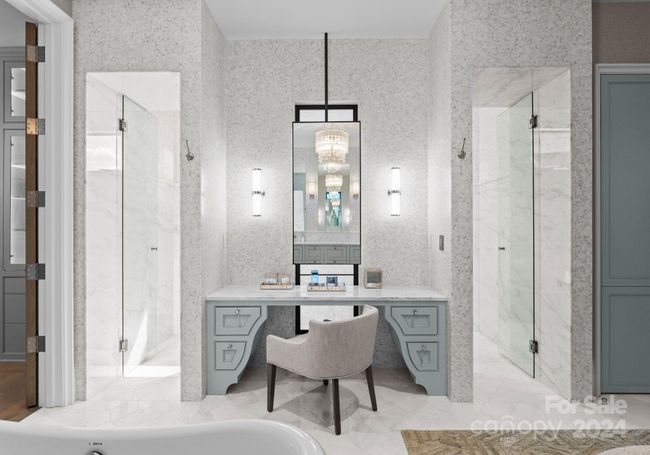 Walls are adorned with gorgeous wallpaper, custom made vanity with a unique cabinet design, framed by two glass door entries to the massive walk-thru shower. | Image 21