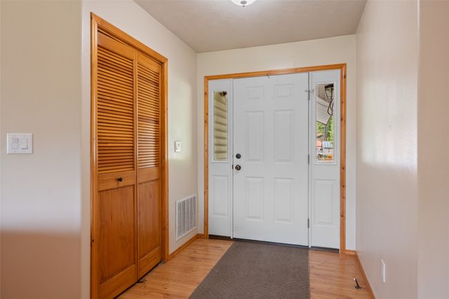 Foyer with light wood-style flooring and baseboards | Image 17
