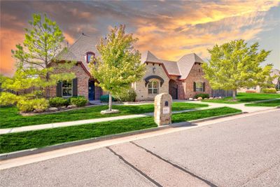 French country style house with a lawn | Image 1