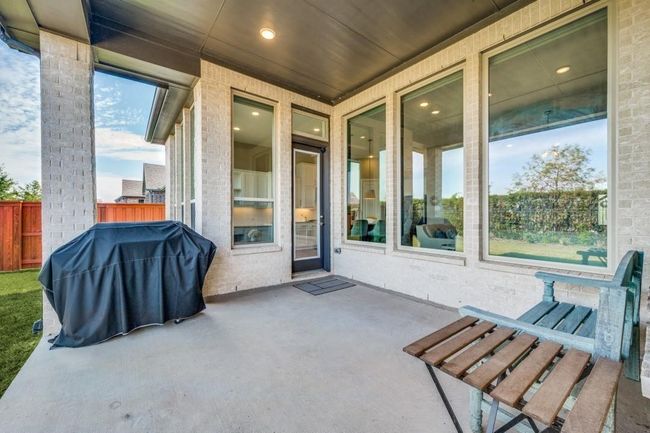 View of patio featuring area for grilling | Image 34