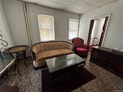 Carpeted living room featuring a paneled ceiling | Image 3