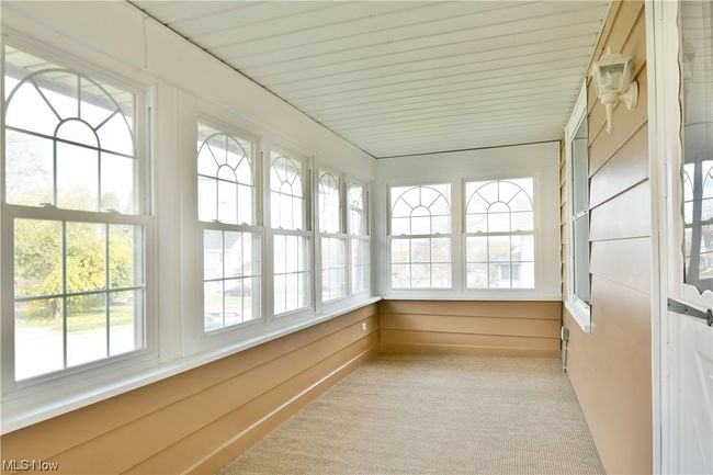View of unfurnished sunroom | Image 6
