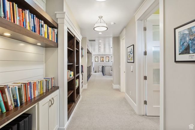 Hallway with light carpet, baseboards, visible vents, and recessed lighting | Image 52