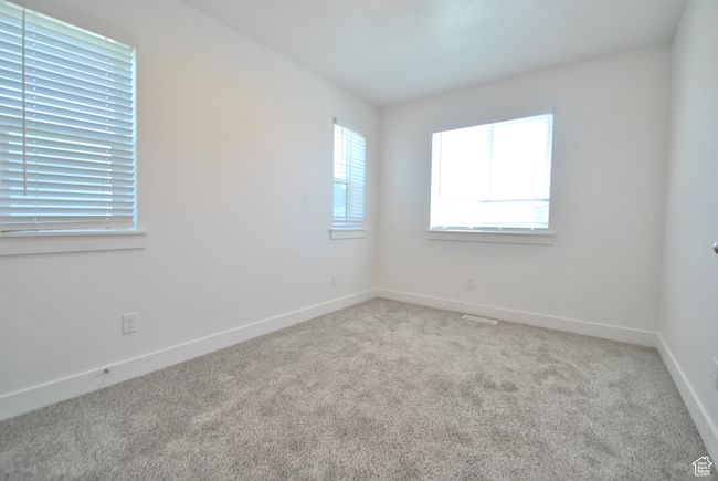 Bedroom featuring carpet floors and baseboards | Image 12