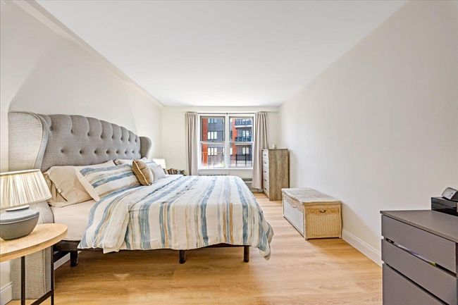 Bedroom featuring light wood-type flooring and baseboards | Image 11