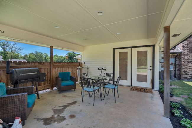 View of patio featuring french doors and outdoor dining area | Image 35
