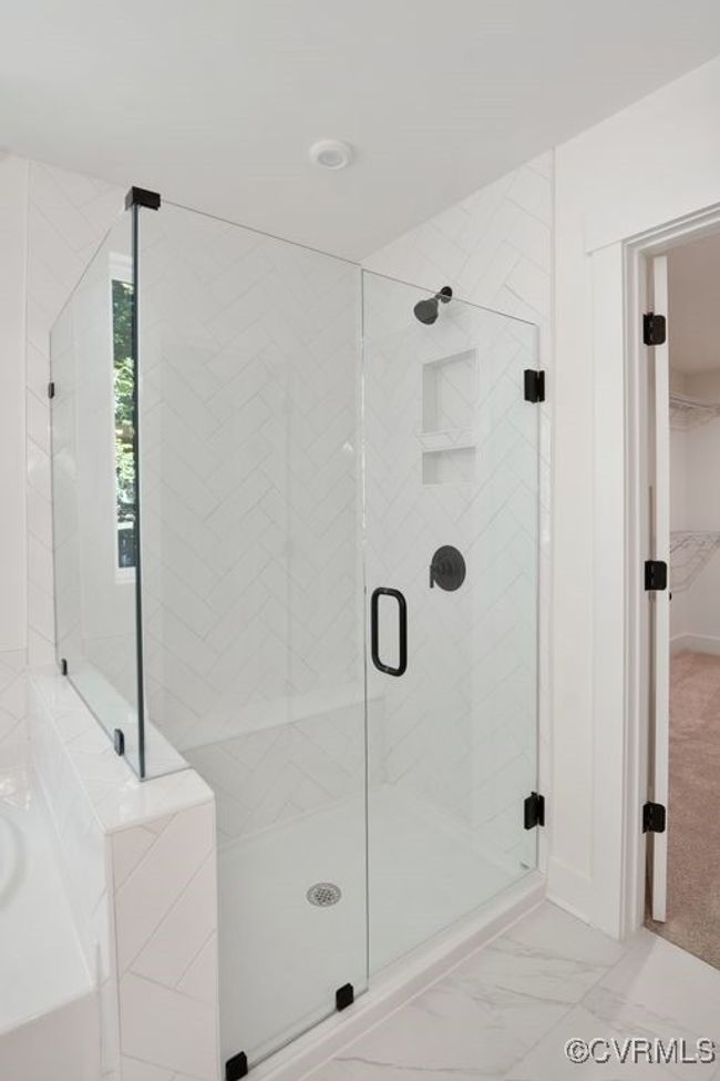 Photo represents the plan, not the actual home. Design selections may vary. On the second floor, you’ll find the primary bedroom featuring a walk-in closet and an ensuite bath with double vanity. | Image 28