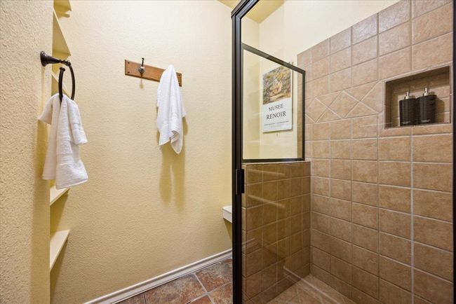A large custom walk-in shower in the second bathroom. | Image 26