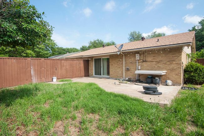 Rear view of property featuring a patio area and a lawn | Image 6