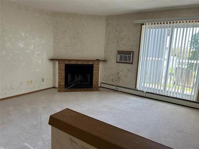 Fireplace in living room. | Image 3