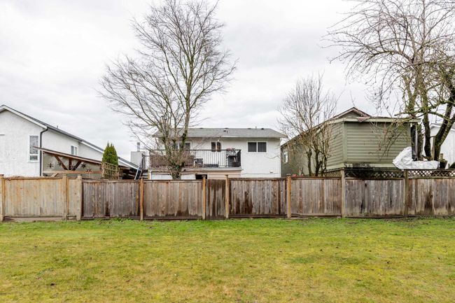 View of fenced backyard | Image 34