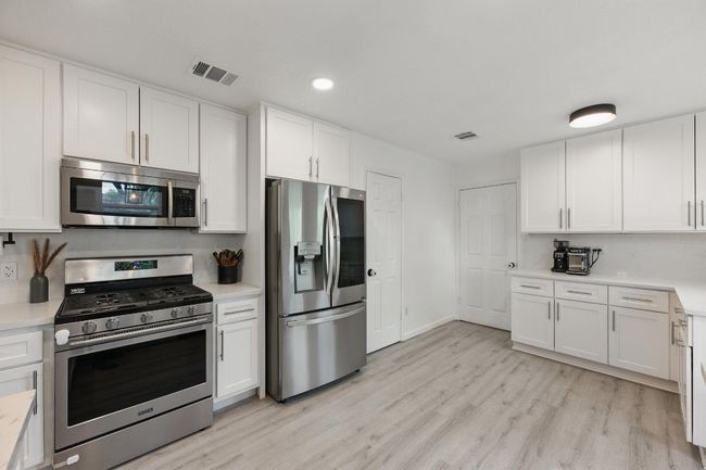 The recent stove, dishwasher, and fridge add convenience, making meal prep and cleanup a breeze. | Image 11