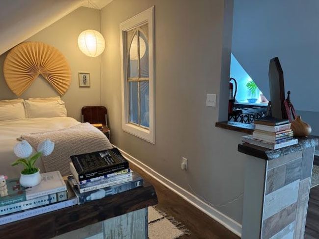 Bedroom featuring dark wood-style floors and baseboards | Image 32