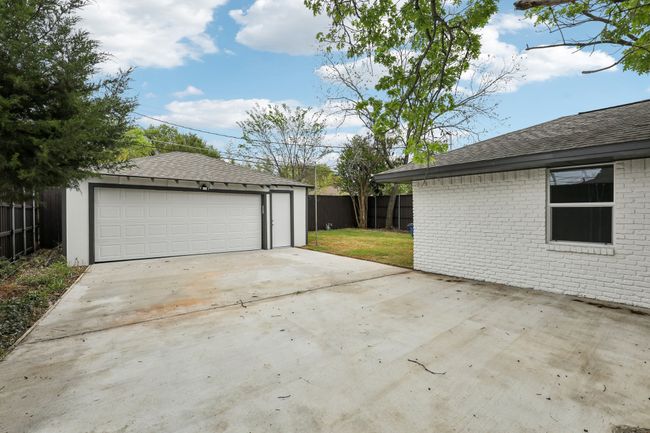 Detached garage featuring fence | Image 32