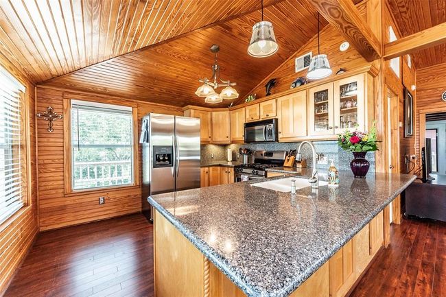 You'll love the exposed beams and all the cabinet space | Image 12