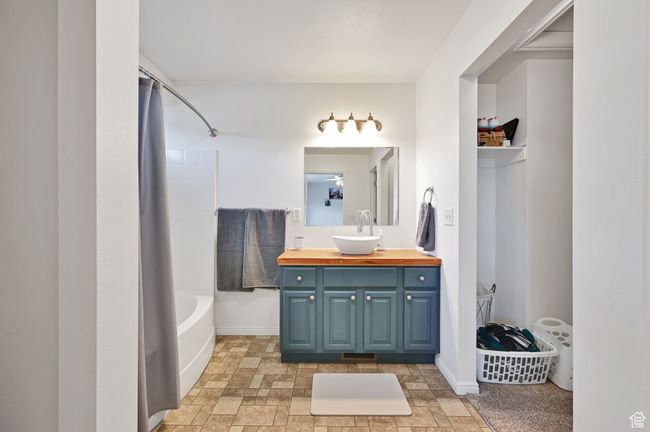 Bathroom with vanity and tub / shower combination | Image 19