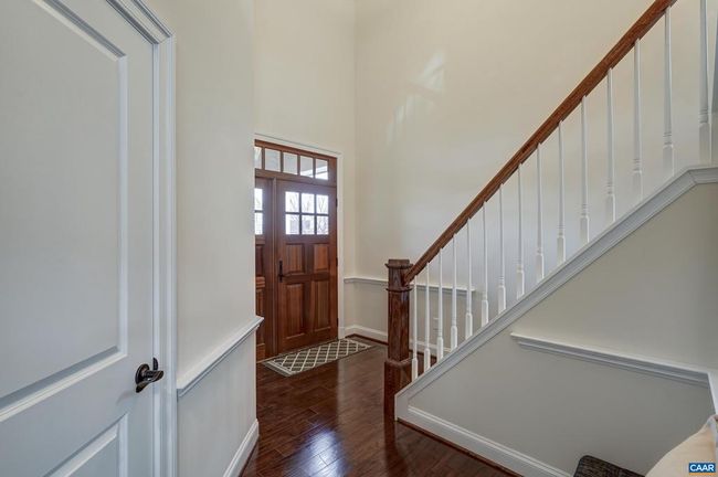 Hardwood flooring throughout the main living spaces sparkle in this light-filled home. | Image 5