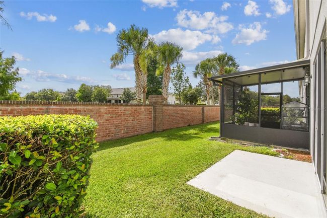 The backyard offers the option for buyer installation of a screened-in patio, already approved by the HOA. | Image 24