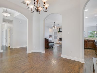 View from dining room - open to kitchen, family room and hallway to secondary bedrooms and bath. | Image 3