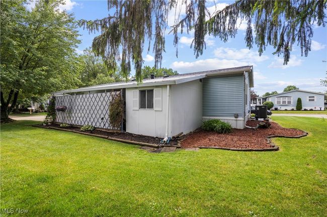 View of home's exterior with a yard | Image 11