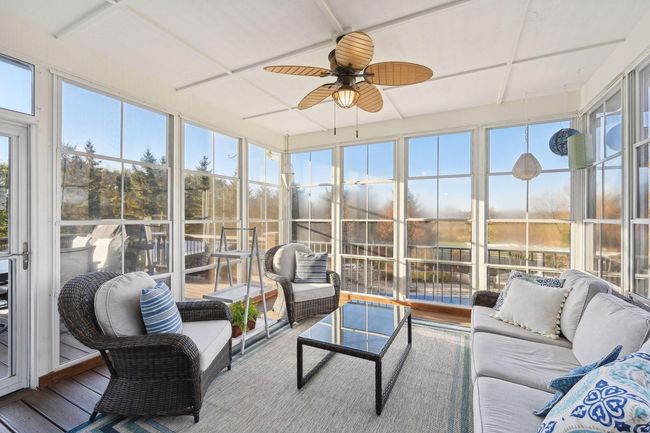 Screened porch with window system that expands the season. Flooring is maintenance free. | Image 29