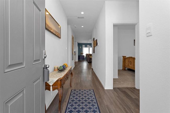 Step inside to vinyl plank flooring. | Image 5
