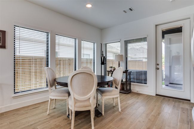 Dining area featuring light wood-style flooring and recessed lighting | Image 18