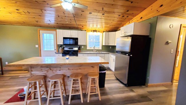 Kitchen with walk out to deck | Image 6