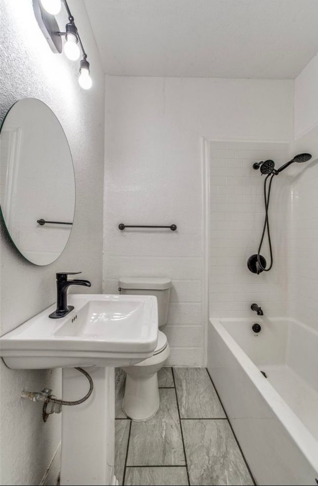Bathroom with marble finish floor and toilet | Image 5