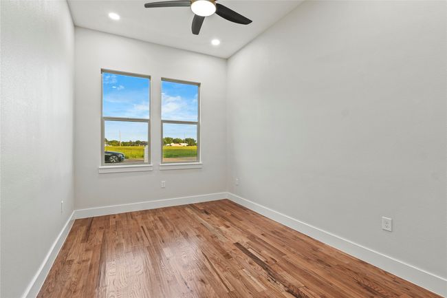 Spare room featuring ceiling fan, wood finished floors, and recessed lighting | Image 18