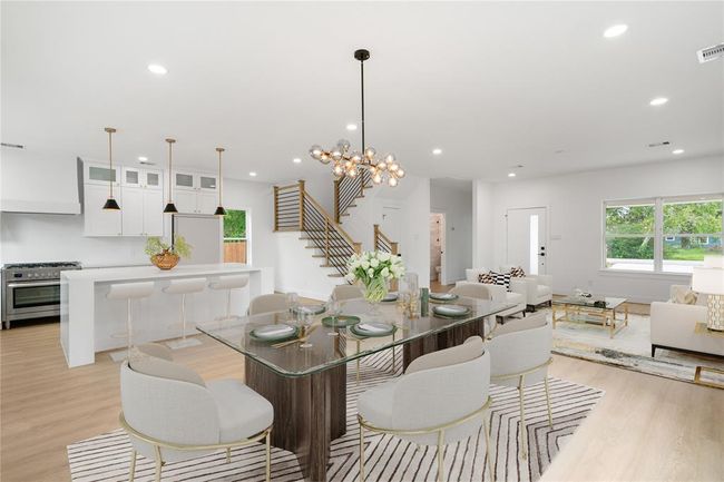 Virtually staged photo of the dining and living area | Image 4