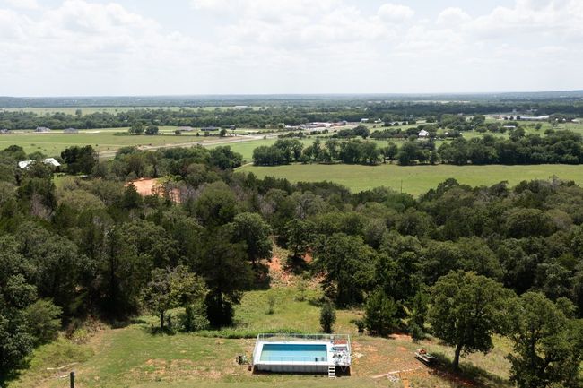 Aerial view of property and surrounding area featuring a pool and rural landscape | Image 7