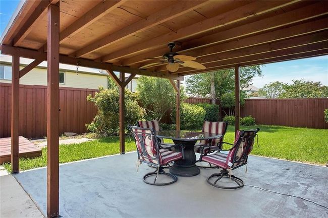 Well landscaped relaxing backyard Cedar covered patio great for entertaining, privacy with board on board fence. | Image 4