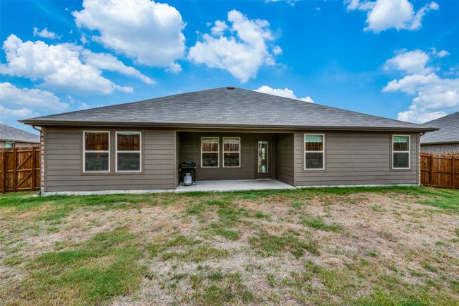 Rear view of house featuring a patio area and a yard | Image 22